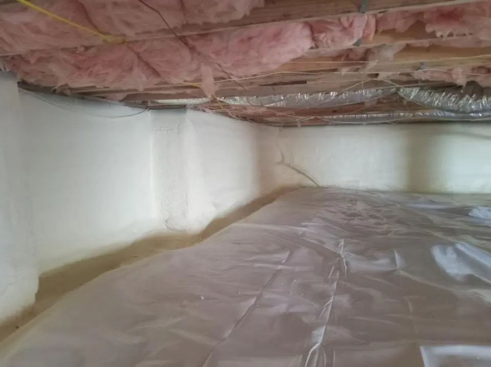 Crawl space encapsulation with closed-cell spray foam for Commercial Roof Restoration in Larchmont
